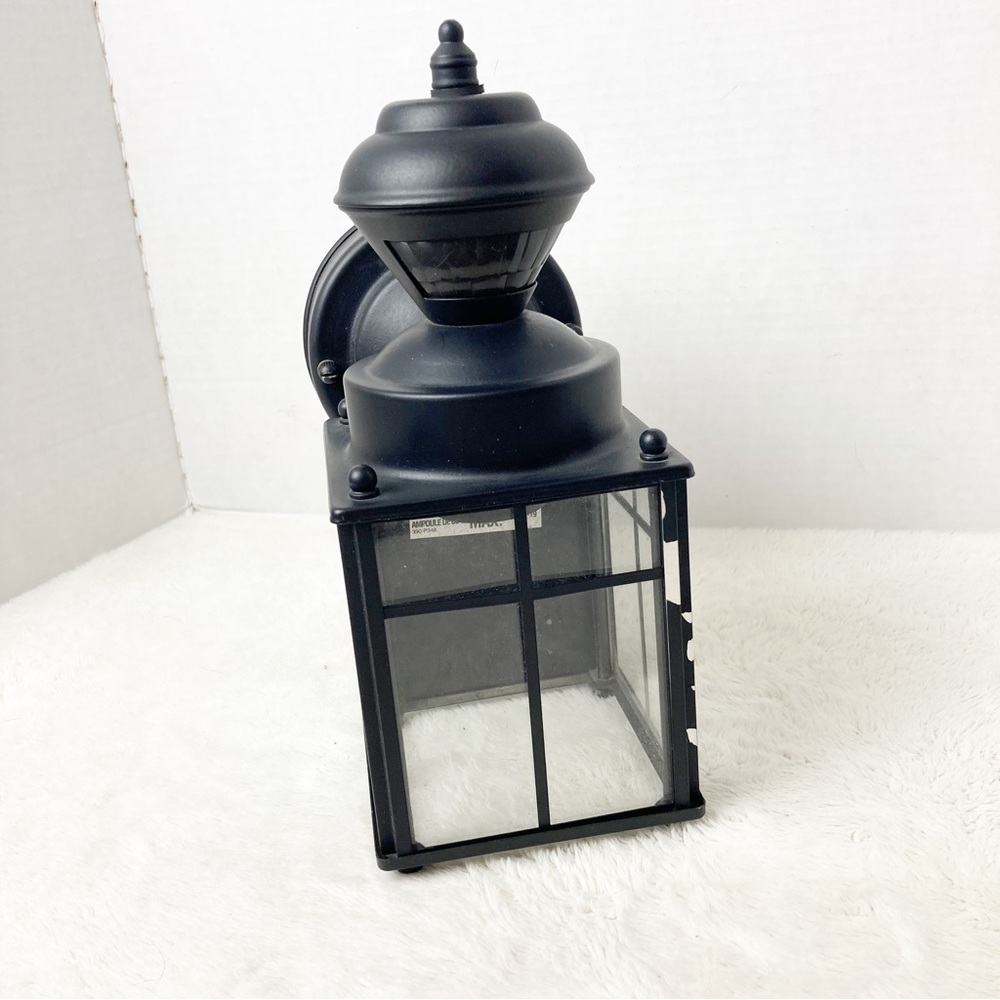 Black outdoor motion light sconce